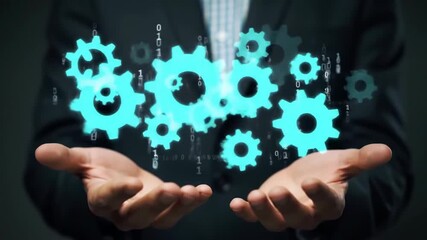 A close up of a businessman in a dark suit holding turquoise gears above his cupped hands, with a digitized binary code background for tech concepts. - Powered by Adobe