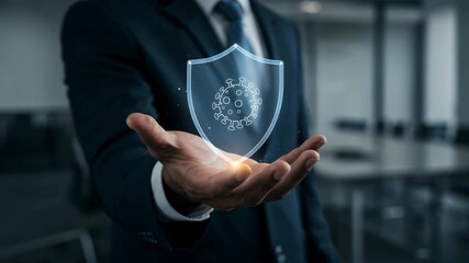 Businessman holding holographic hand shield with virus icon for protection healthcare security hologram promoting prevention and workplace safety - Powered by Adobe