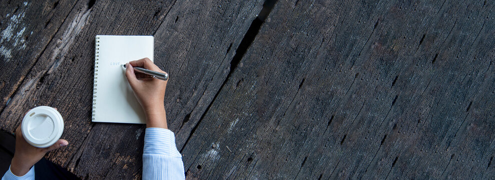 Banner Businesswoman hands note meeting document in conference room. Woman Hands writing planning on notebook. Female hand holding pencil write on diary sketchbook. Business Planning with copy space