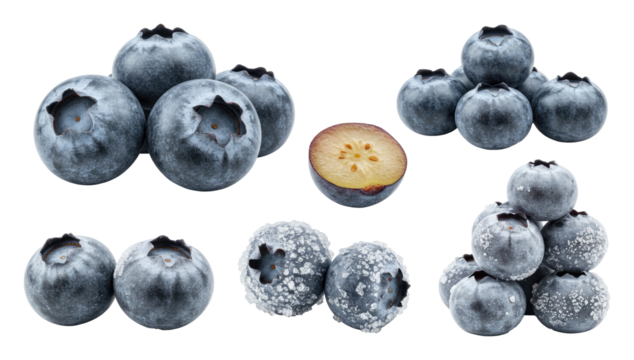 Fresh blueberries in clusters with halved berry showing flesh and light frost on surfaces