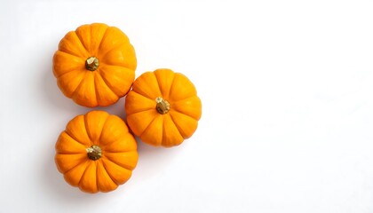 Three Mini Pumpkins on a White Background, Top View.