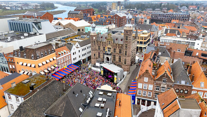 Venlo city center aerial cityscape view, Dutch traditional Vastelaovend carnival party and festival on market square, crowd of people, Venlo, Limburg, the Netherlands