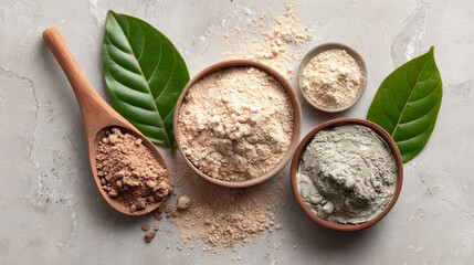 “Flat lay of cosmetic clay products with dry powder and mixed clay mask, styled with a green leaf on a marble surface.”