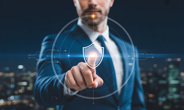 Professional businessman in suit activates digital shield interface, protecting data and network in futuristic city skyline background, symbolizing cybersecurity and corporate security solutions.
