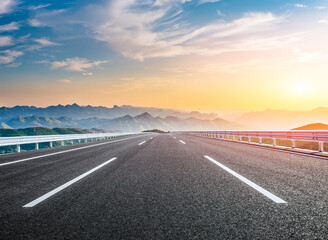 Empty asphalt highway road and mountain range with beautiful sky clouds natural landscape at sunset