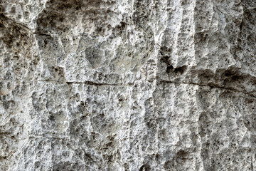 texture of gray stone surface with rough natural patterns and depth. Ideal for use as a background...