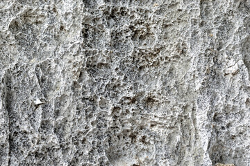 texture of gray stone surface with rough natural patterns and depth. Ideal for use as a background...
