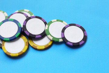 Casino chips on blue background.