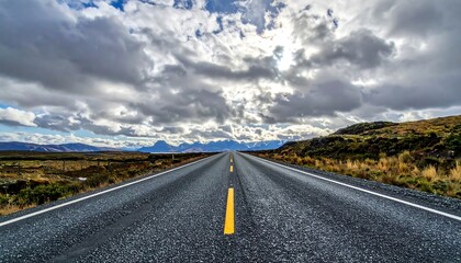 Endless Road Under Dramatic Sky - A Journey Through the Landscape.
