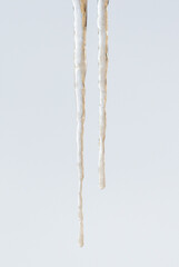 A long icicle hanging from the ceiling