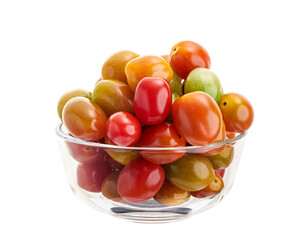 Colorful cherry tomatoes (Solanum lycopersicum var. cerasiforme) in glass bowl isolated on white background with clipping path