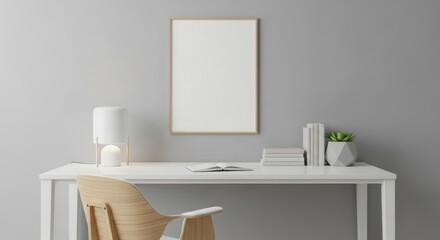Minimalist office space with white desk and artwork on light gray wall