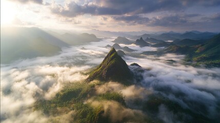 overlooking. Majestic mountain peak at sunrise overlooking sea of clouds with golden light. travel magazines, destination branding, designed for travel destination branding.