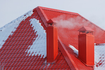 A red roof with snow on it