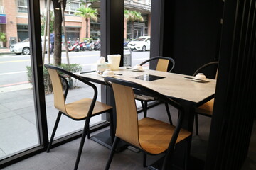 Restaurant Interior with Table and Chairs near Window