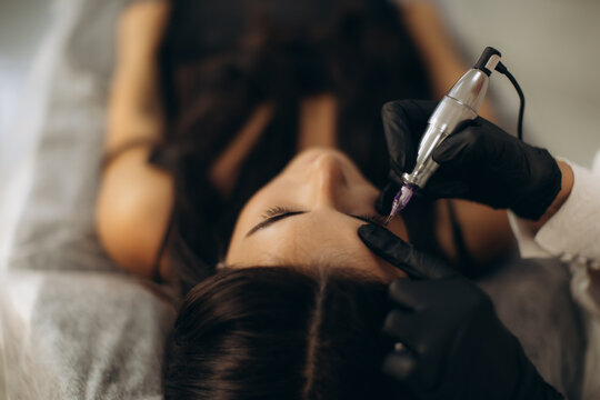 Woman receiving permanent eyeliner makeup procedure
