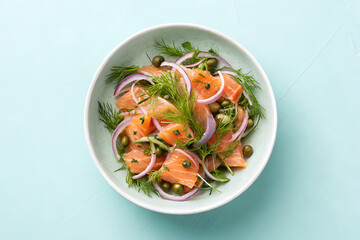 Fresh salmon salad with citrus and herbs in a white bowl