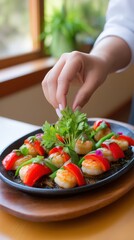 Hands placing the final shrimp on a sizzling seafood paella skillet with saffron rice, minimalistic background with soft blur, warm natural light from side window, earthy tones with yellow, red, and