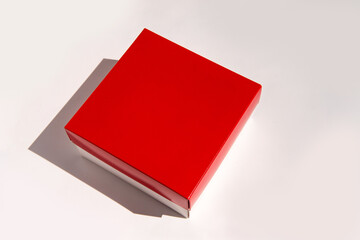 Red square box on white background with subtle shadow