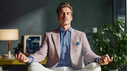 Businessman meditating cross‑legged in a stylish office—mindfulness at work, stress relief and leadership clarity for corporate wellness programs, HR communications and productivity campaigns