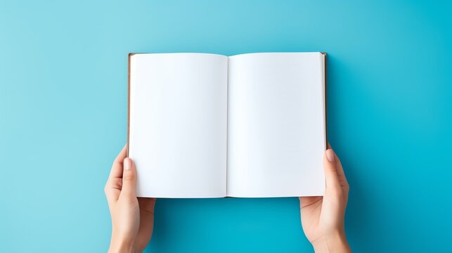 Open book on a blue background, ready to write.