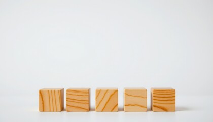 Natural Wooden Blocks Arranged in a Row on a Minimalist White Background for Creative Projects and Education
