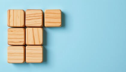 Wooden Blocks Arranged on Blue Background Creating Minimalist Spatial Composition and Design Aesthetic