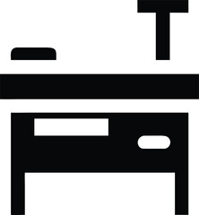 A simple black icon represents a desk with a drawer and a lamp together