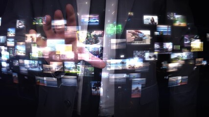 Businessman browsing holographic image gallery using augmented reality interface - Powered by Adobe