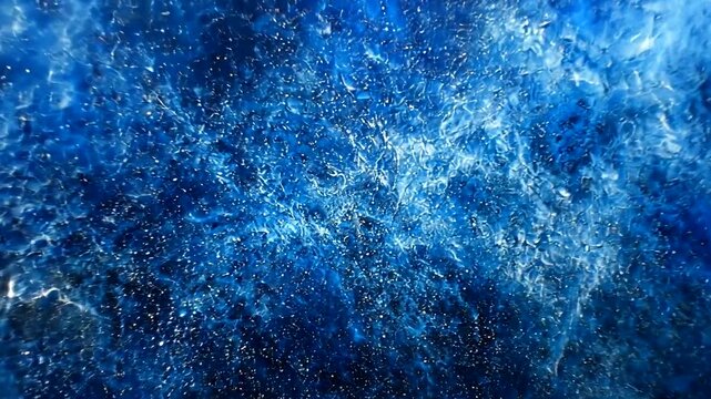 Dynamic abstract blue texture, like ocean depth with scattered light reflections