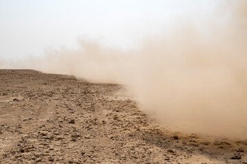 Zikreet, Qatar - November 15, 2025: A large storm formed, powdered dust and sand on the ground were blown into the clouds, causing the orange glow to look horrible. extreme weather events.