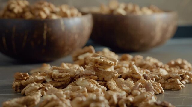 Explore the beauty of walnut kernels scattered on a kitchen counter, highlighting their nutritious value and ideal for healthy snacking at any time.