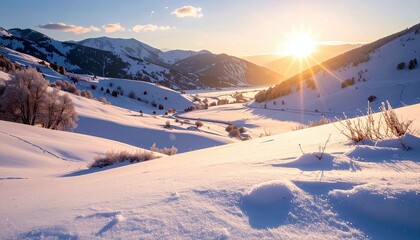 A breathtaking sunrise casts a warm golden glow over a pristine snow-covered mountain valley, illuminating rolling hills and scattered trees.