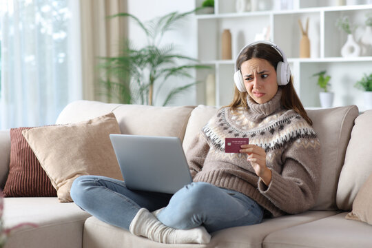 Suspicious woman in winter buying media online at home