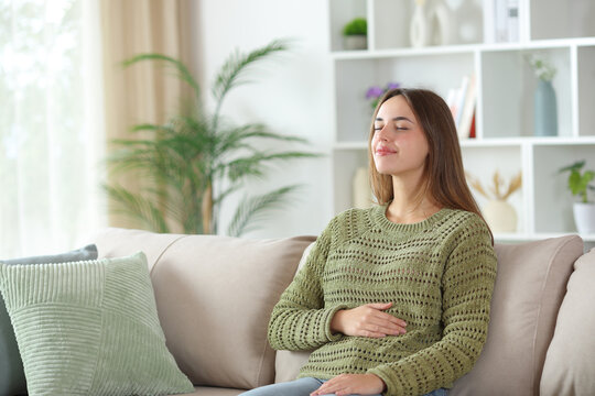 Fototapeta Woman enjoying a healthy bowel tract at home