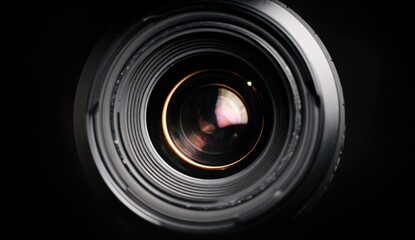 Close-up view of a professional camera lens showcasing intricate details, reflections, and textures, emphasizing the art of photography and capturing moments with precision and clarity