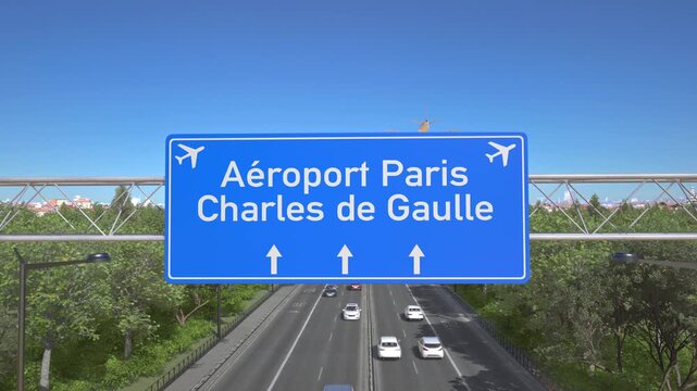 Blue motorway sign for Paris Charles de Gaulle Airport with an airliner flying above along the road toward the airport