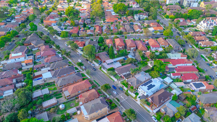 Obraz premium Aerial Panorama Drone View of a inner western Sydney Suburb of Ashbury Urban Sprawl and the terracotta roof tops streets and trees of Suburban Sydney NSW Australia