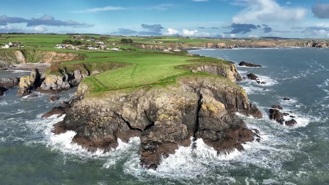 Ireland Epic Locations rough seas waves crashing on rocks dunabrattin Head Copper Coast Waterford after winter storm