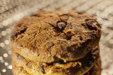 Sweet chocolate chip cookies on a metal grill grate