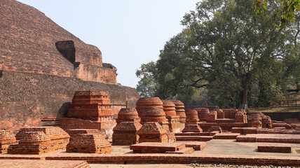 Fototapeta premium India, Bihar, Rajgir, View of Ancient Ruins of Worlds Oldest Nalanda University, The Red Brick Monuments With Ruin Buddha Vihara's Around Campus.