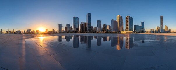 Fototapeta premium Modern city skyline reflected in wet pavement at sunrise panorama