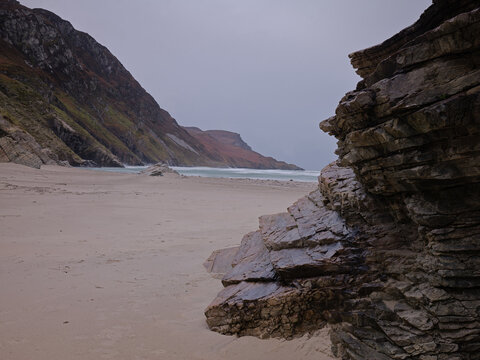 Rugged Rocks at Maghera Beach Donegal Ireland With Rough Sea Under Stormy Sky