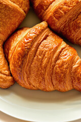Plate of freshly baked French croissants