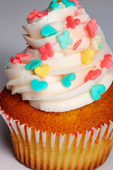 A delicious layered cake is topped with fresh raspberries and blackberries, showing vibrant colors and contrasting textures.