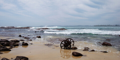Rusted abandoned Wheels on a beach
