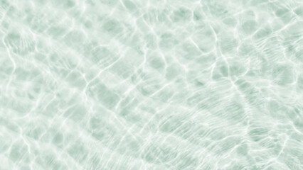 A background of clear water over a sandy bottom. Shallow water with white sand. Gentle ripples on the surface. Glittering reflections on the sea.