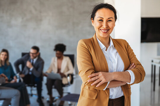 Professional in office environment, highlighting teamwork, collaboration, leadership, and innovation - Powered by Adobe