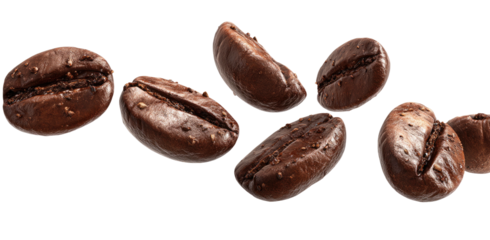 Close-up of rich dark roasted coffee beans scattered on a black background