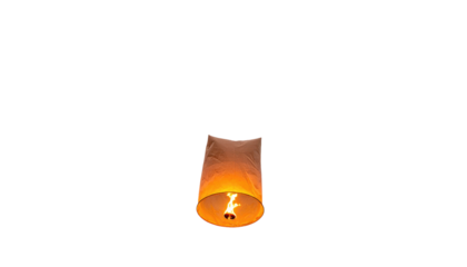 A single paper lantern illuminated from within floating against a stark, black background. The flame creates a warm glow